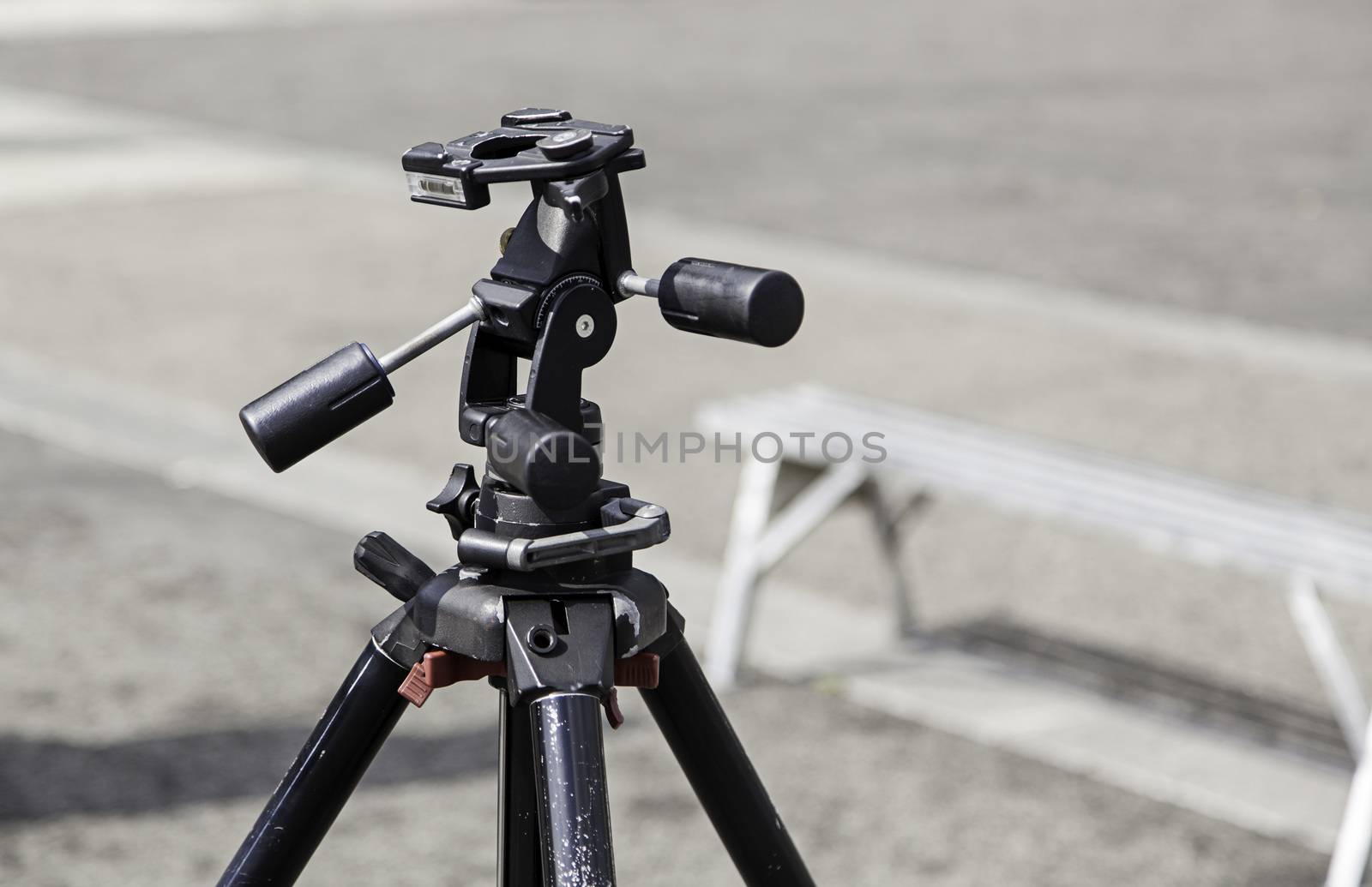 Tripod for photographers, detail of a tool for taking photos