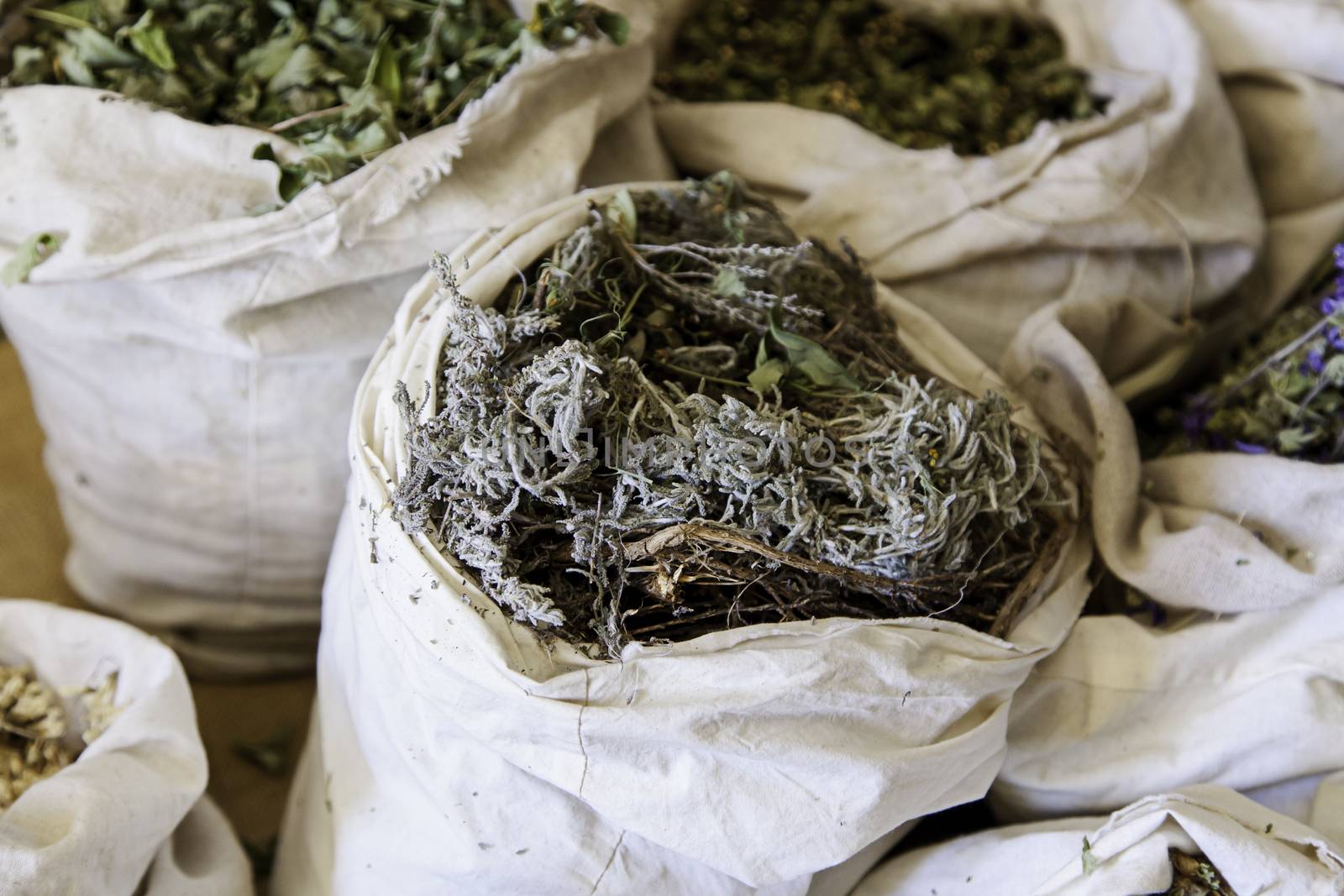 Aromatic herbs in a market, detail of herbal medicine and condiments, aroma and taste, health