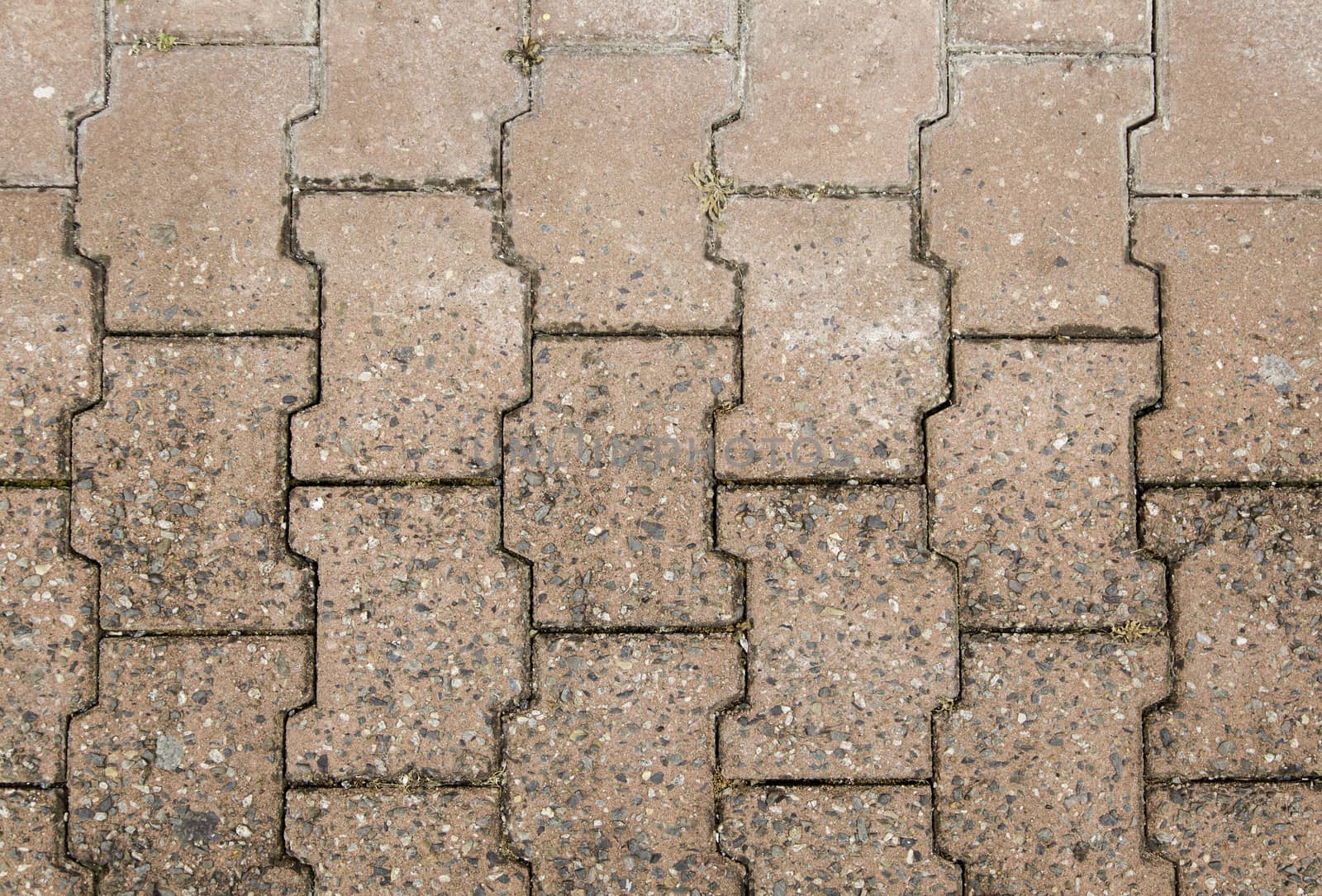 Textured floor of stone pavers, pedestrian sidewalk, background