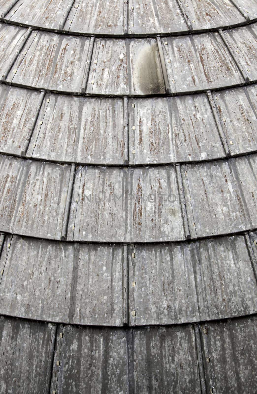 Old weathered metal roof, detail of protection against rain, rusty metal