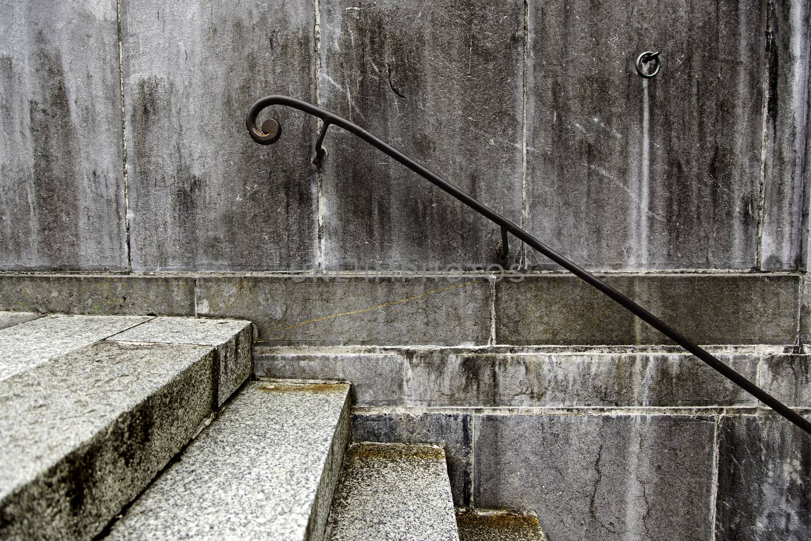 Old dirty stairs with railing, detail of an old city