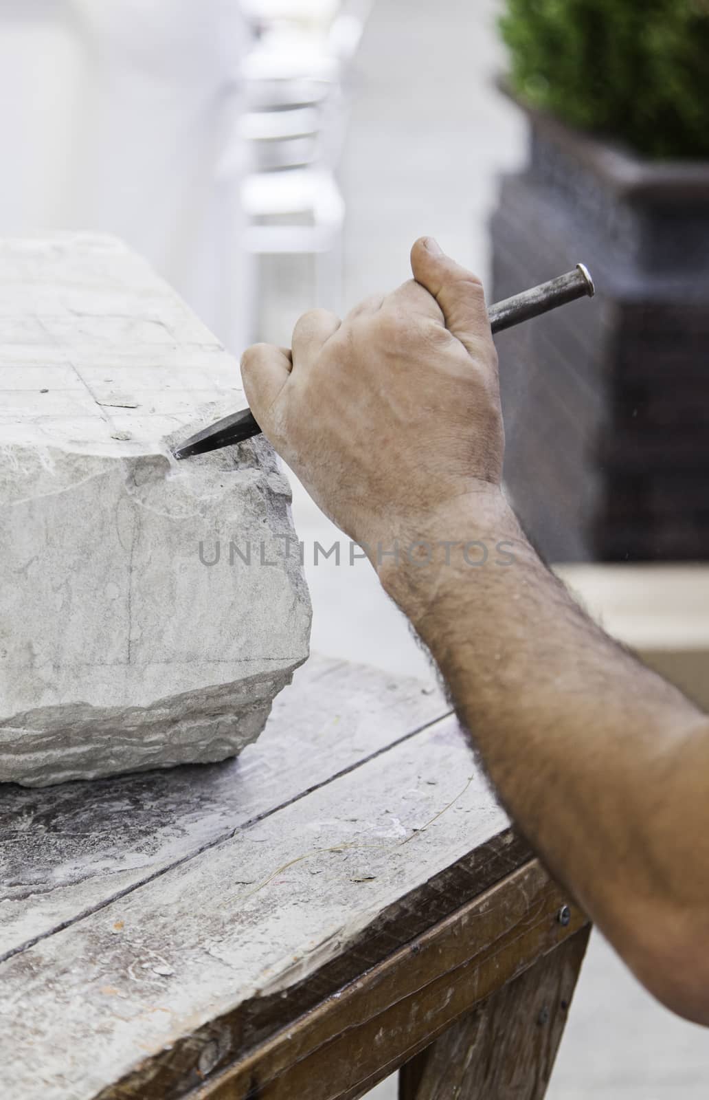 Carving stone, craftsman shaping stone, art and crafts