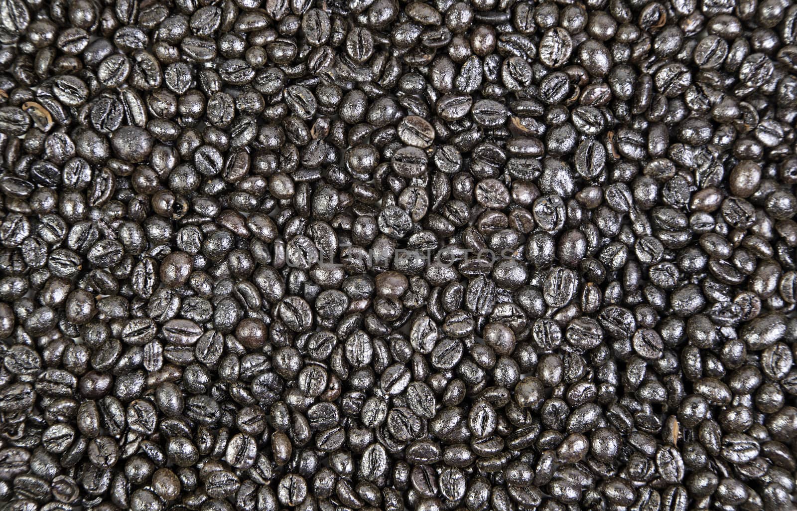 Brown background texture, detail of roasted coffee beans, flavor and caffeine
