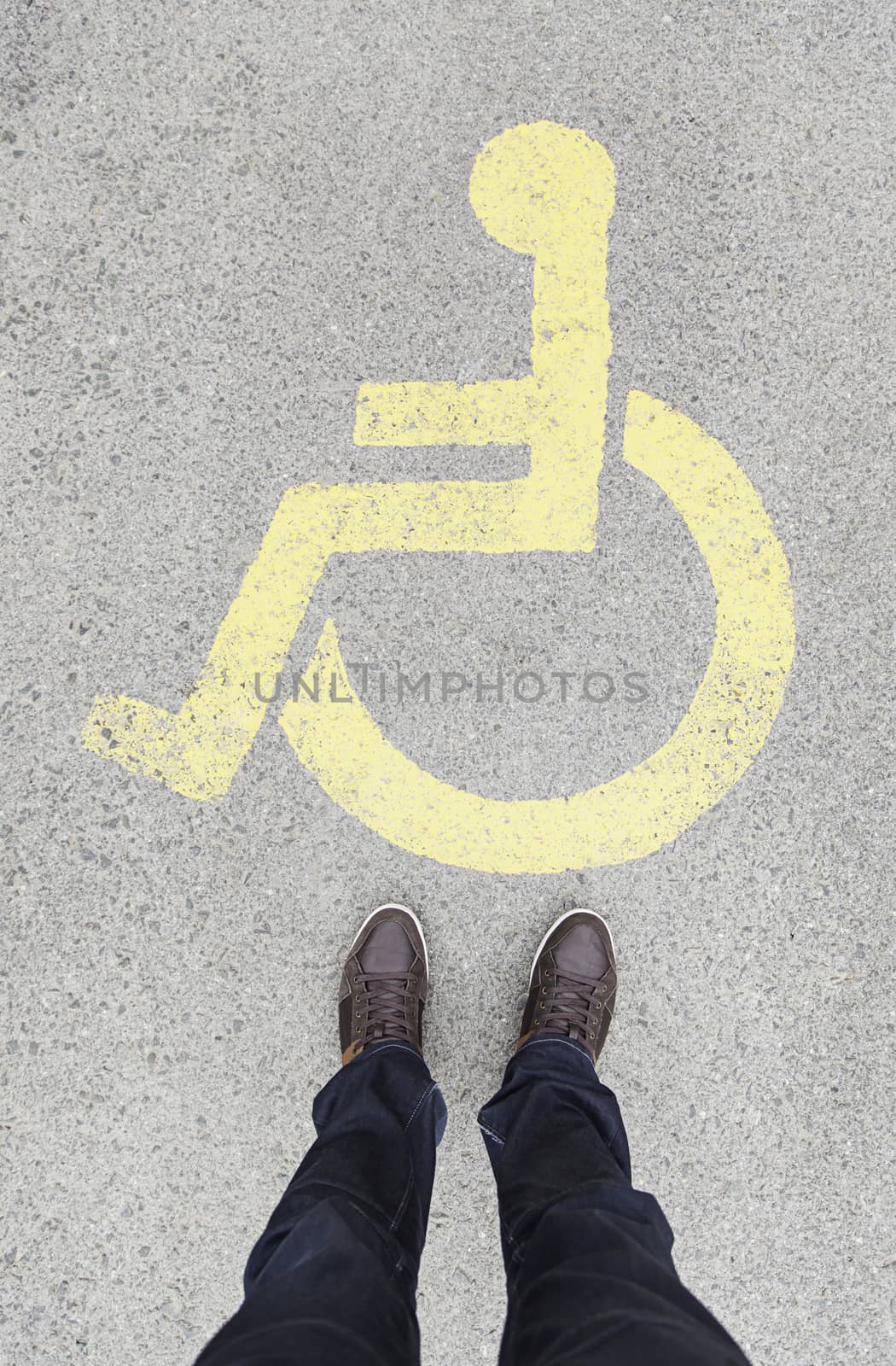 Handicapped sign on the floor, feet pointing signal for help