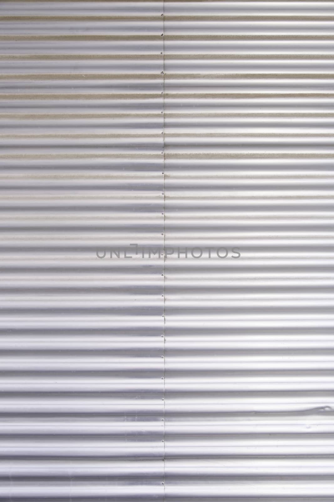 Bright metal background, detail of a textured steel