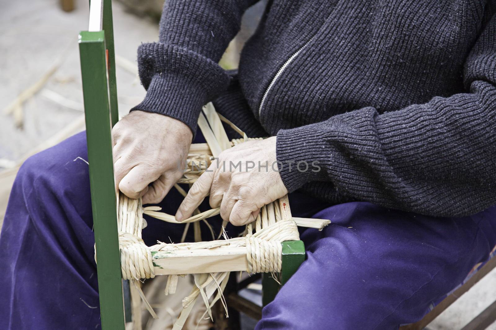 Craftsman wicker person working with his hands, arts and crafts