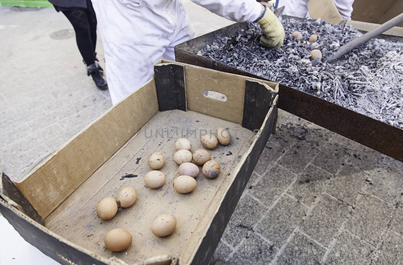 Eggs in a charcoal grilling, detail of how to cook some eggs, feed and food