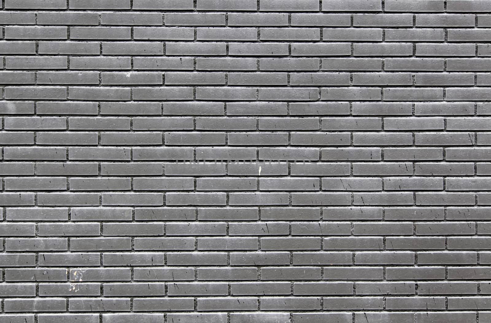 Black bricks in a wall, detail of a textured, architecture and decoration
