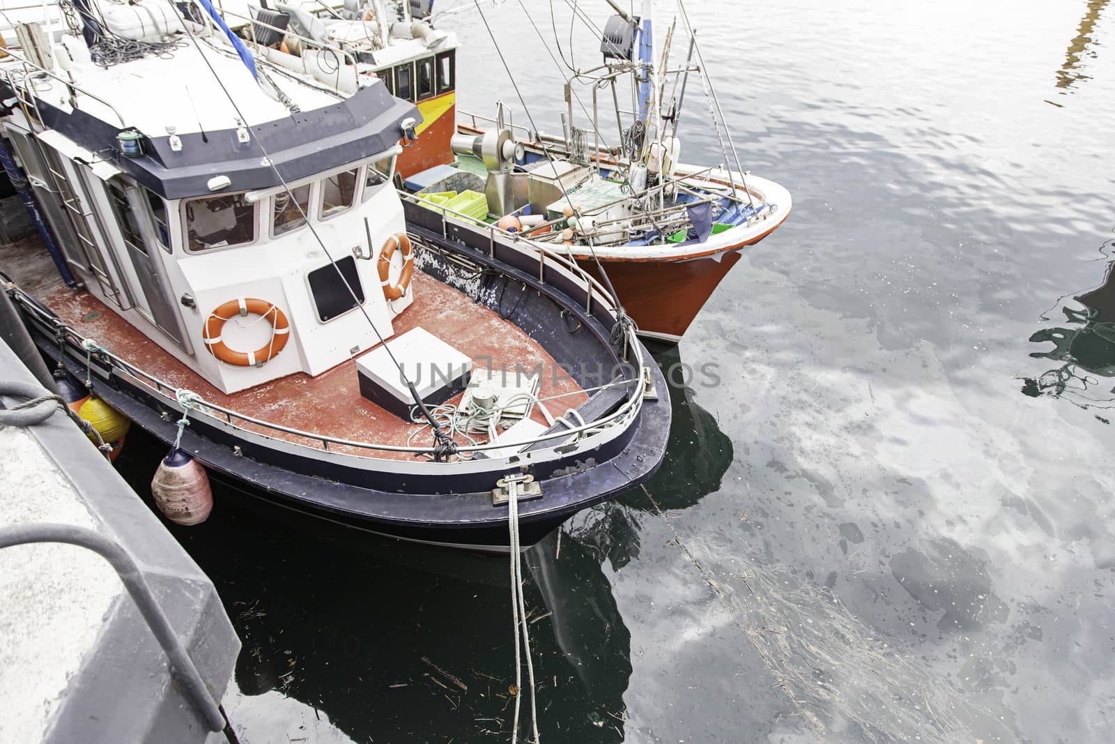 Boats moored at the dock, detail of a ship at sea, maritime transport