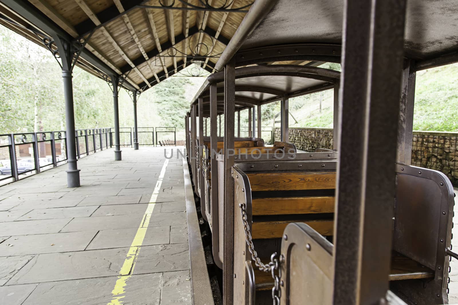 Old wooden seats in a train by esebene