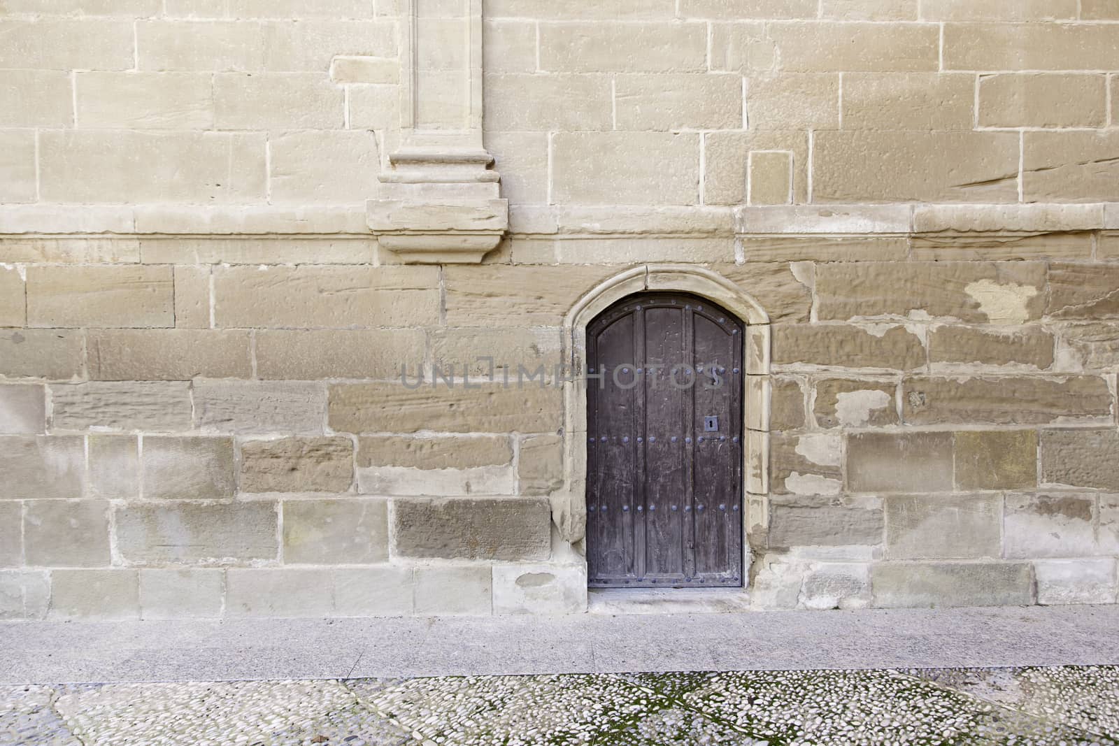 Old wooden door, detail of an entry in an old church
