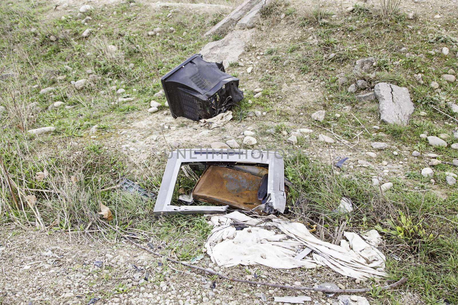 TV broken and abandoned, detail dirt and neglect