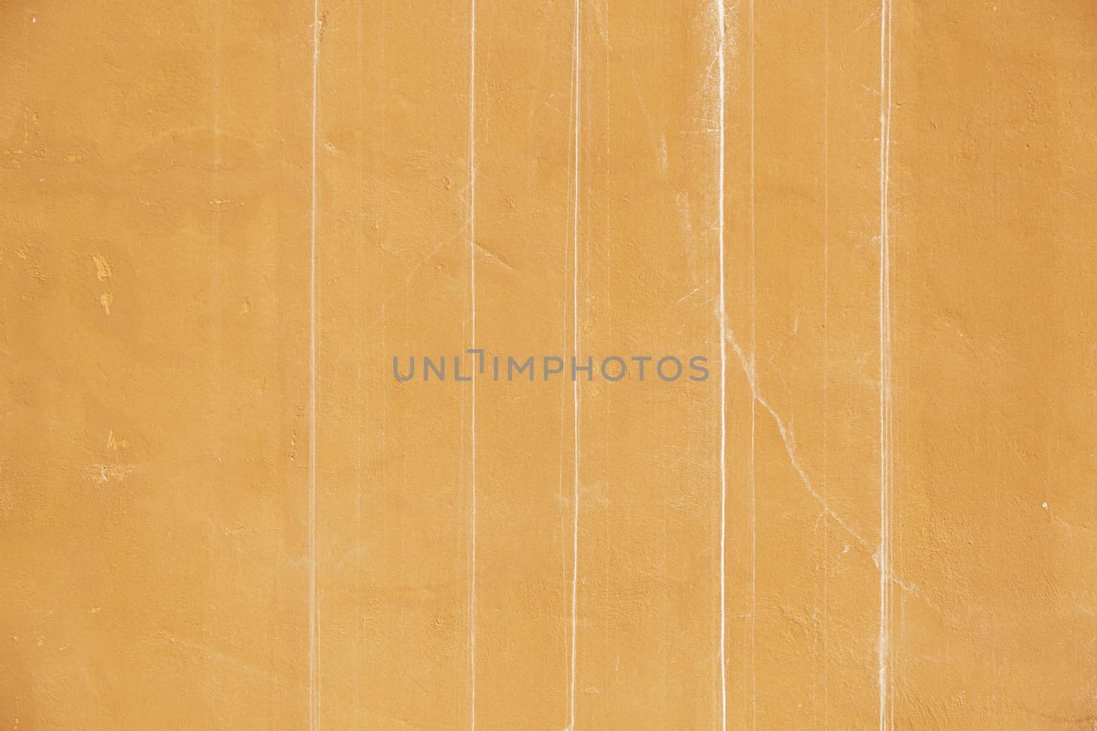 Orange cracked wall, detail of a textured, deterioration