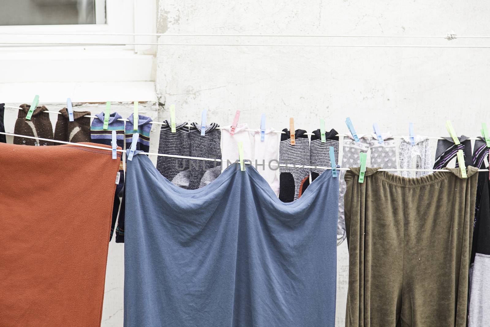 Clothes hanging on the street, detail of clothes drying in the street, casting