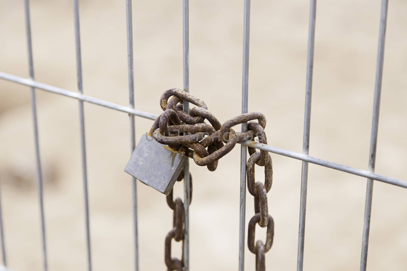 Padlocked iron gate, detail of protection and safety