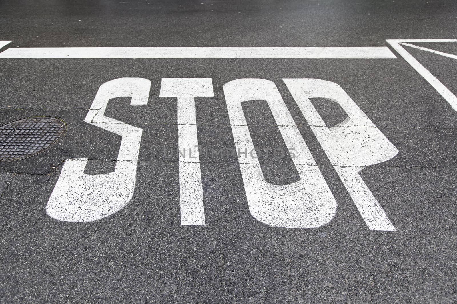 Stop sign on asphalt by esebene