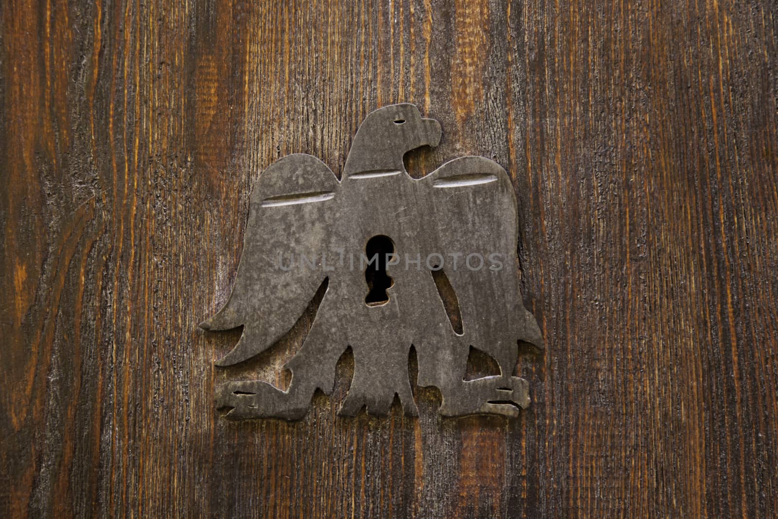 Old medieval wooden door with lock by esebene