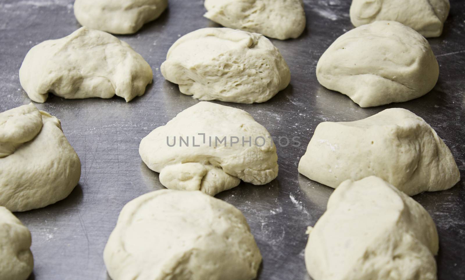 Masses of bread in an old bakery, detail of daily food, artisan manufacture
