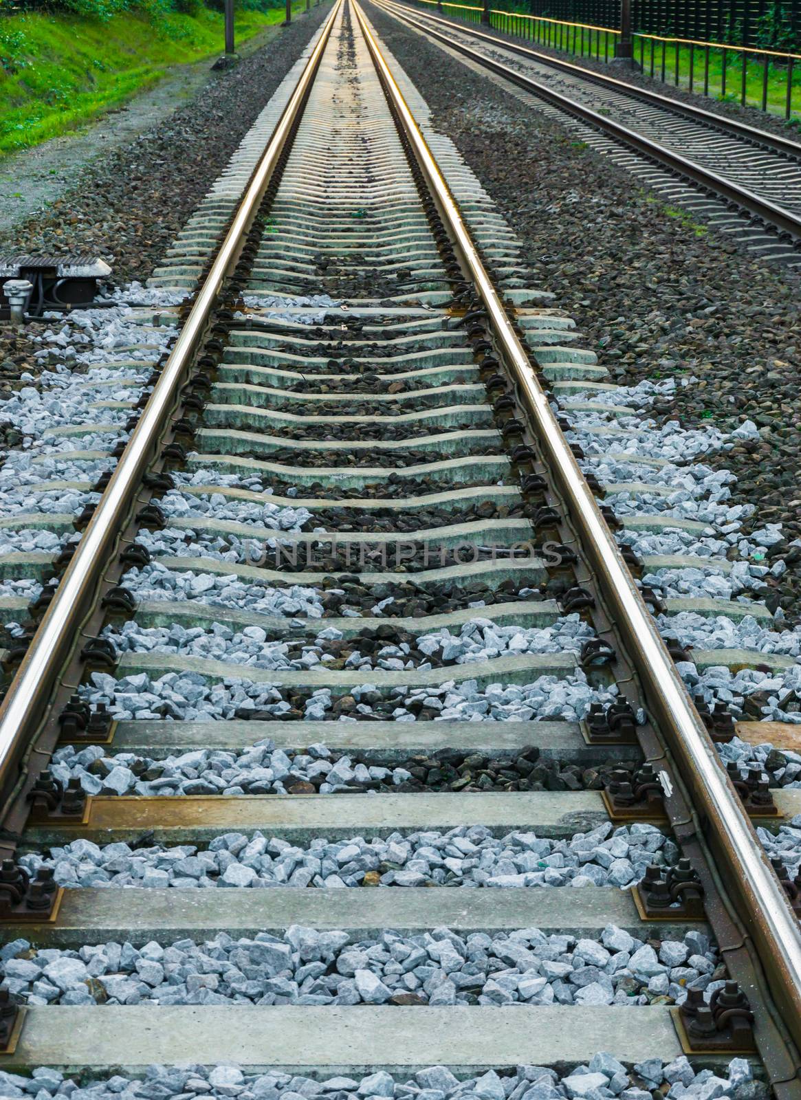 Long train railroad track in closeup transportation and travel background