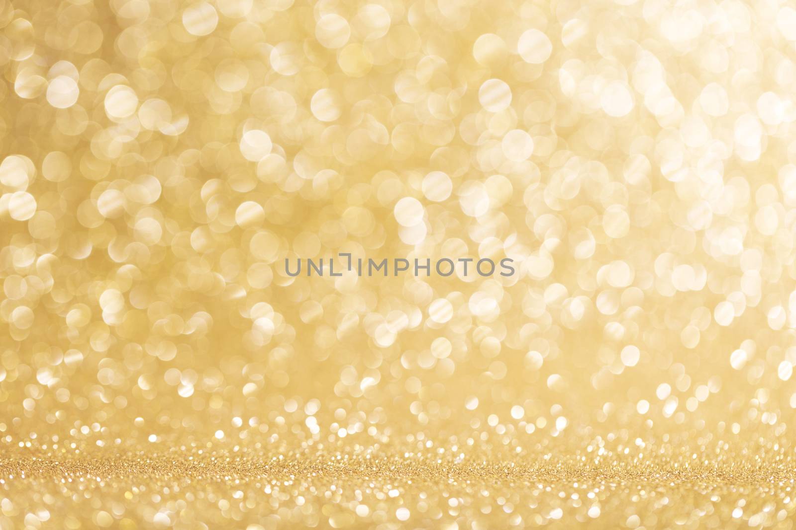 Abstract shining glitters gold holiday bokeh background with copy space for text