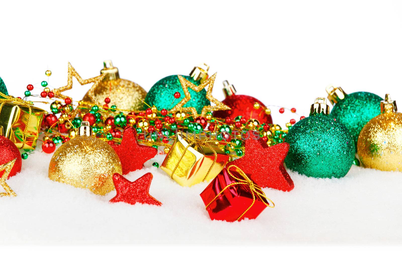 Beautiful colorful christmas decoration in snow with white copy space