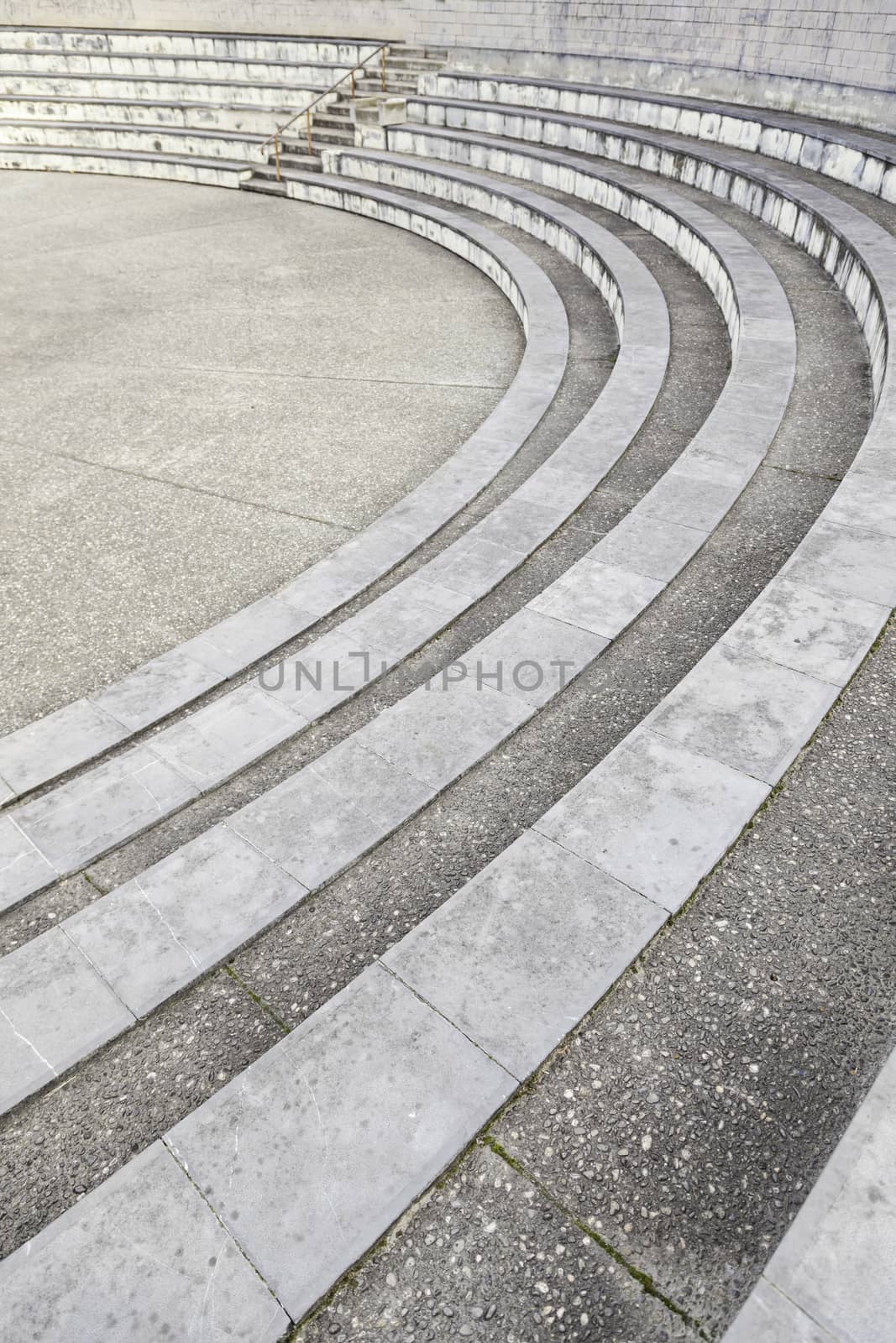 Stone steps in an amphitheater, detail of a spectator bleachers, ancient monument