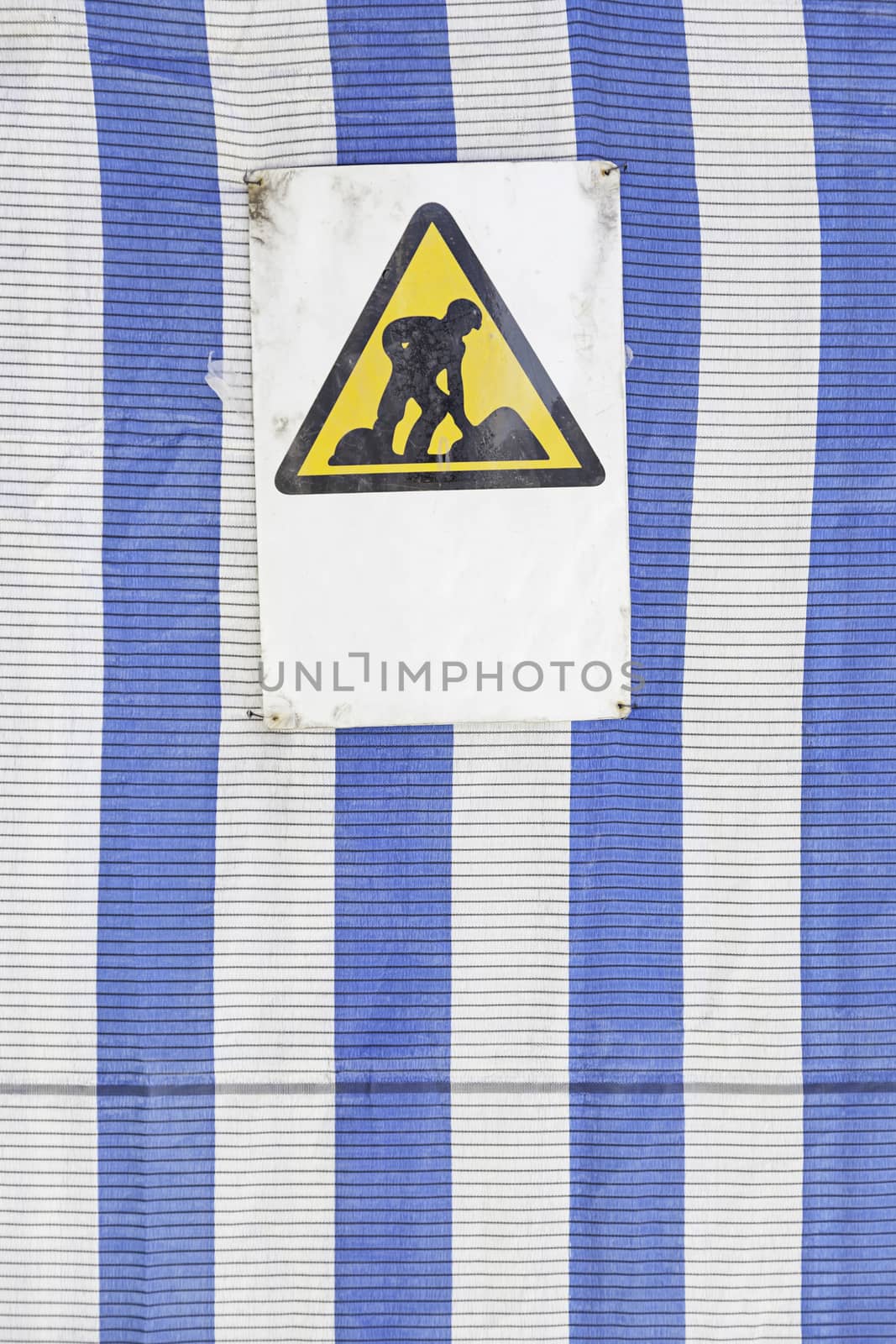 Signal construction sites, detailed information and a sign of danger, people working