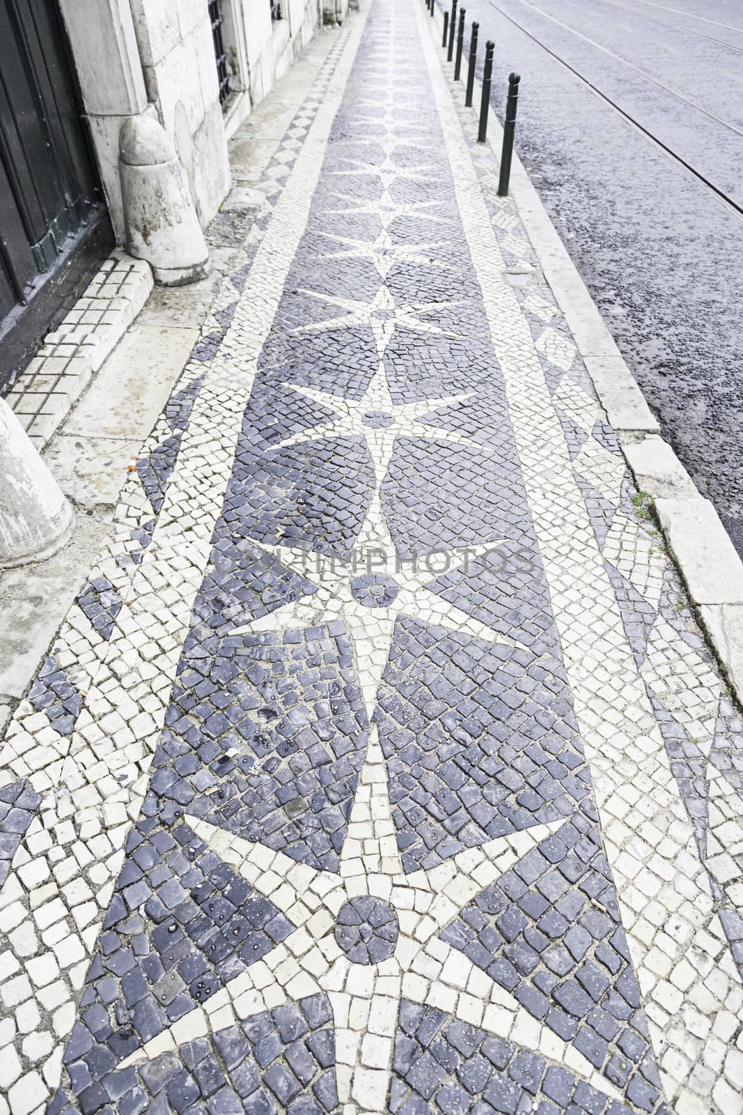 Typical stone floor Lisbon, detail of a typical floor with shapes and drawings, art Portugal, tourism