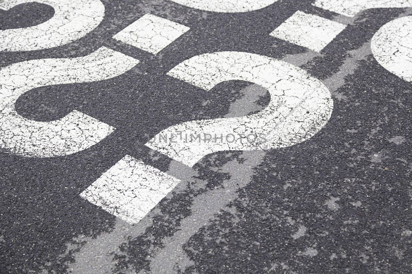 Sign question on asphalt, detailed interrogation signal, information