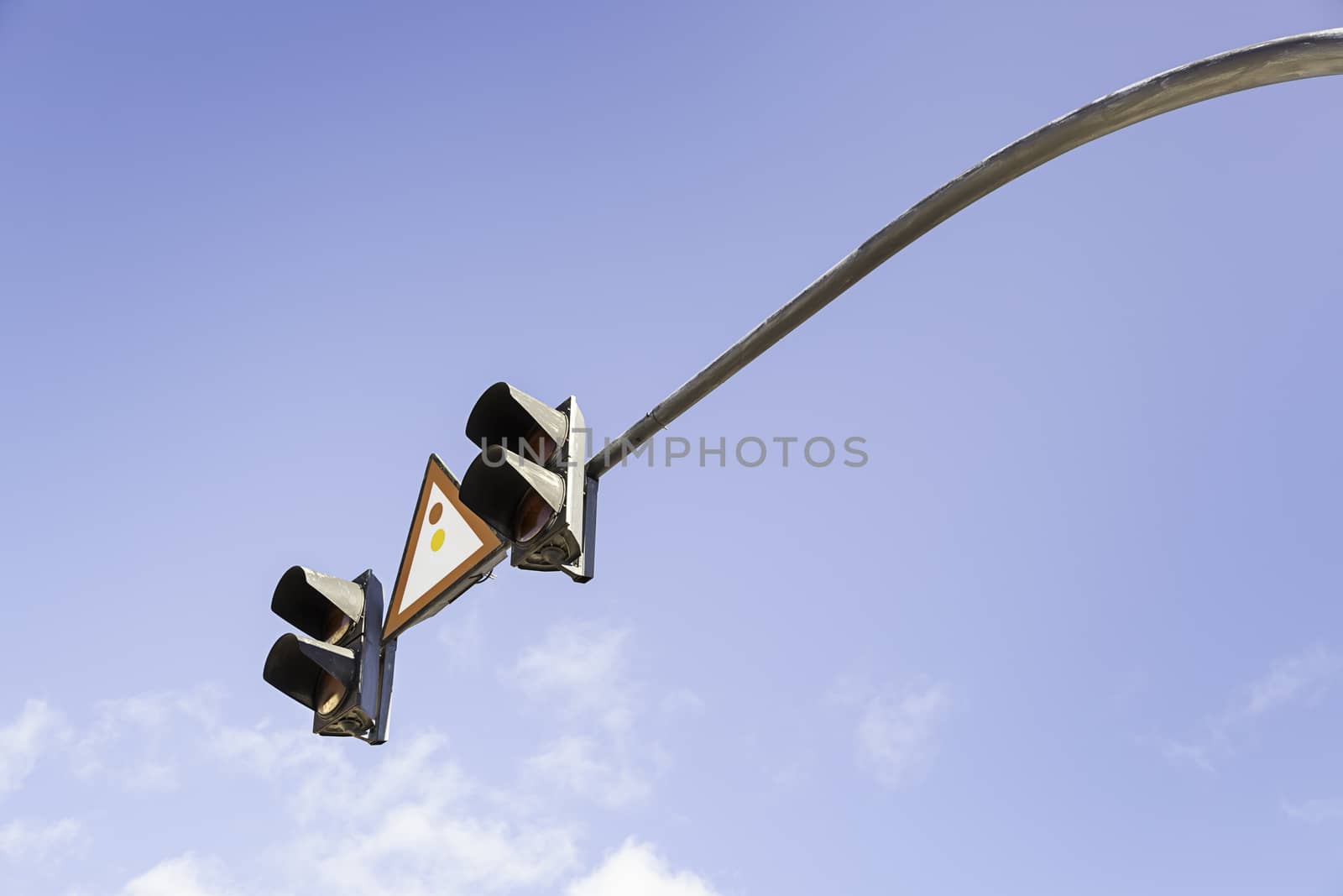 Traffic light in the sky, detail of a traffic signal for vehicles, safety and information