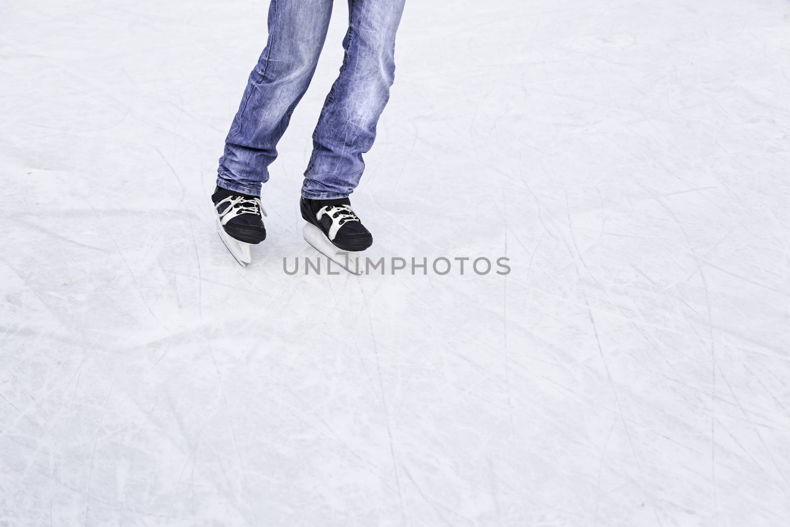 Skating on the ice, skating young person in an ice rink, winter sports, cold and fun