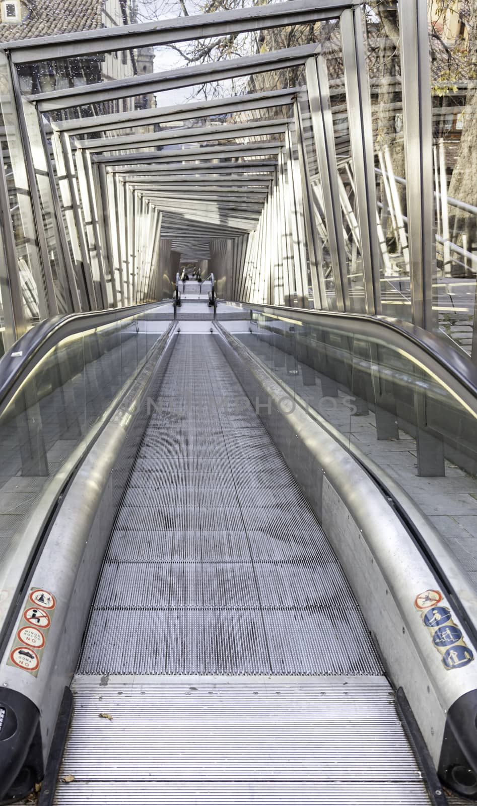 Escalator in the city, detail of stairs to climb a street in the city comfort, modern