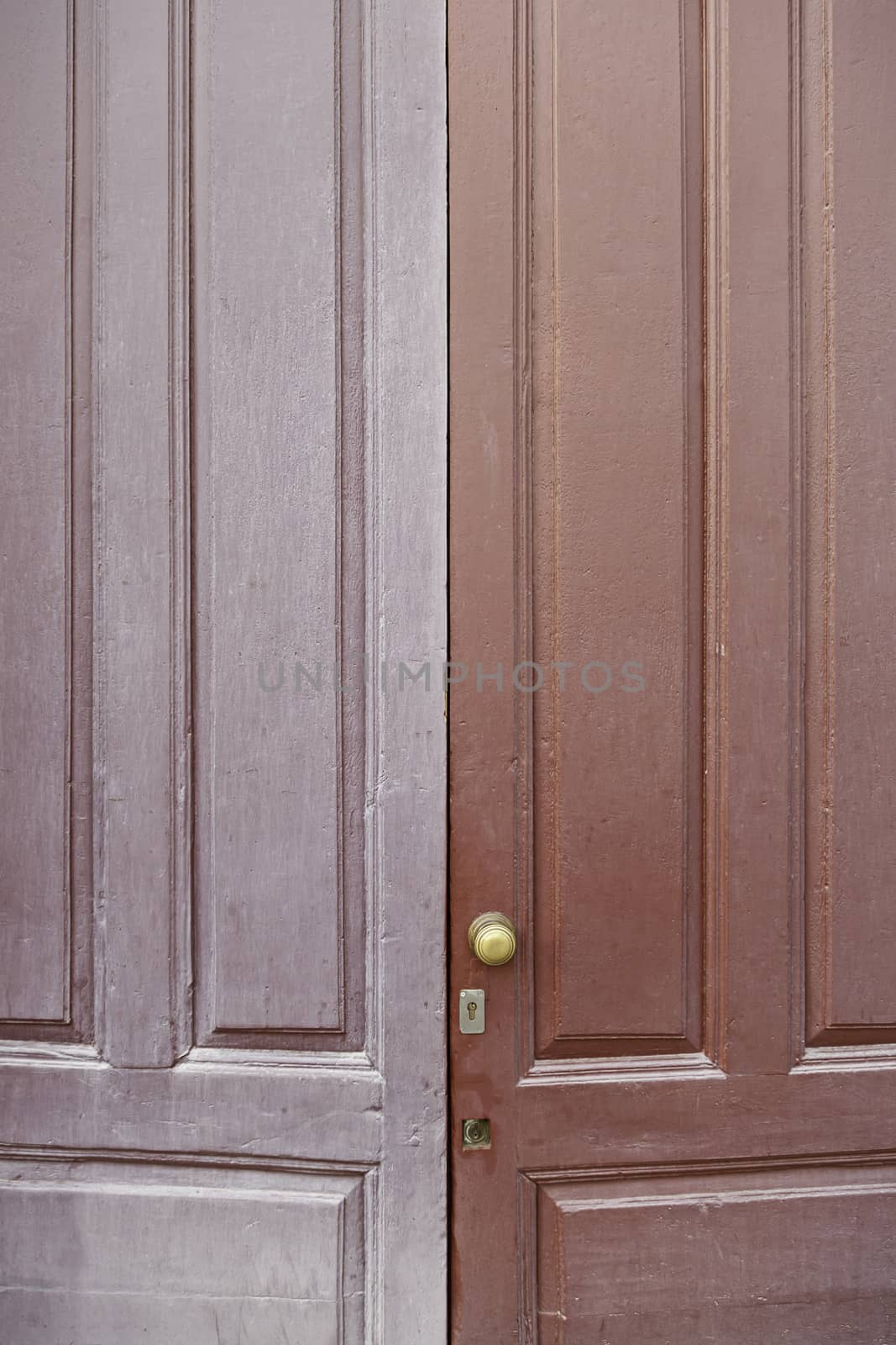 Door wood old and dirty, detail of an old door painted with two colors, decoration and protection