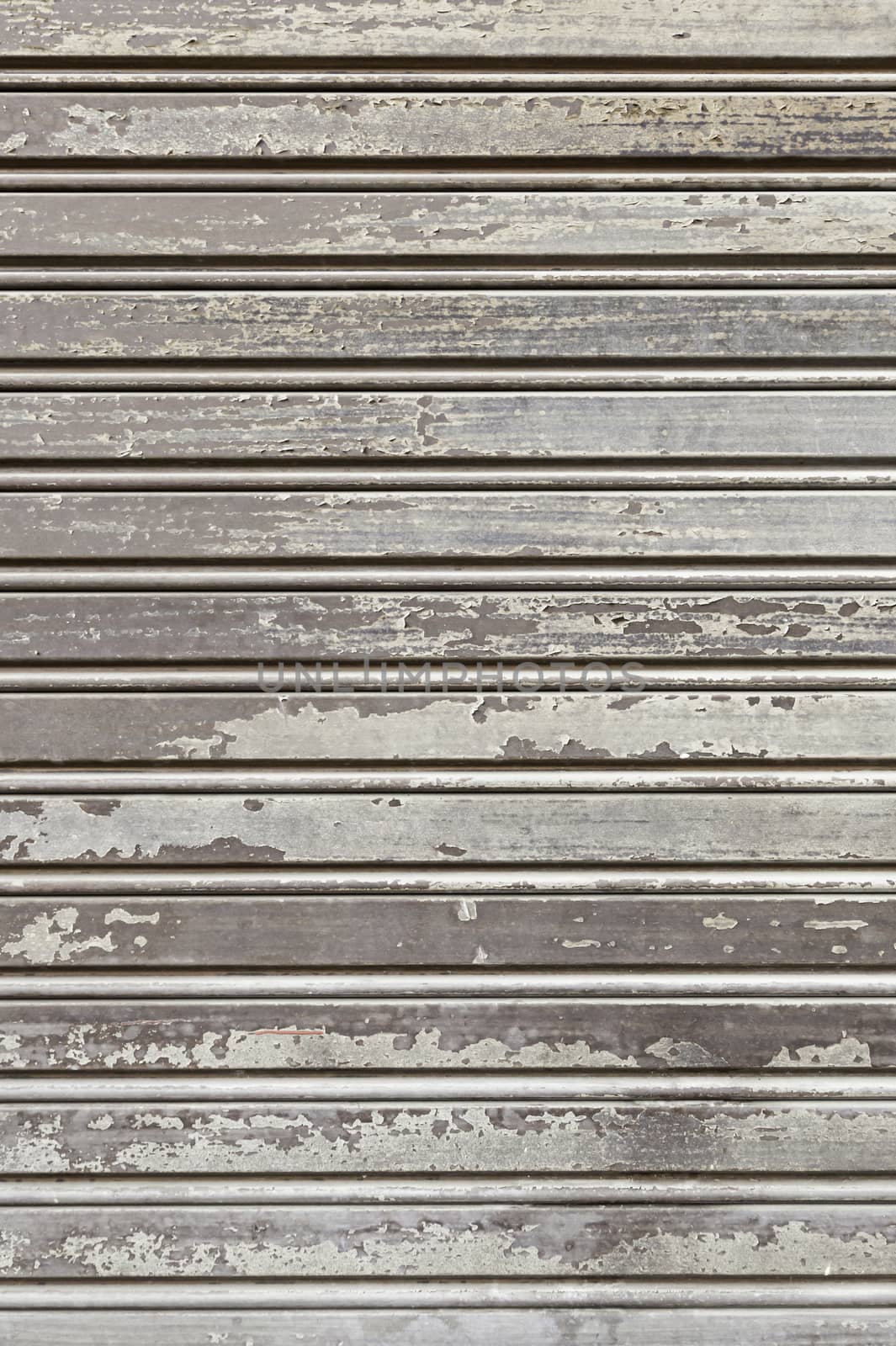 Old wooden fence, detail of a wall covered with wood protection and decoration, dirty and abandoned