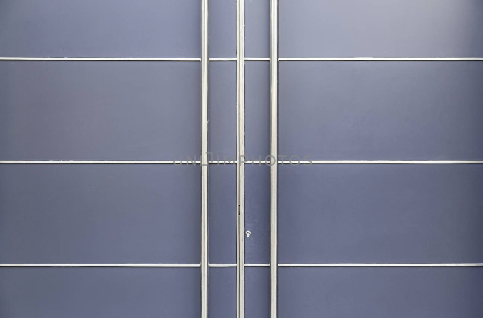 Modern metal door, detail of a door in a modern building architecture and protection