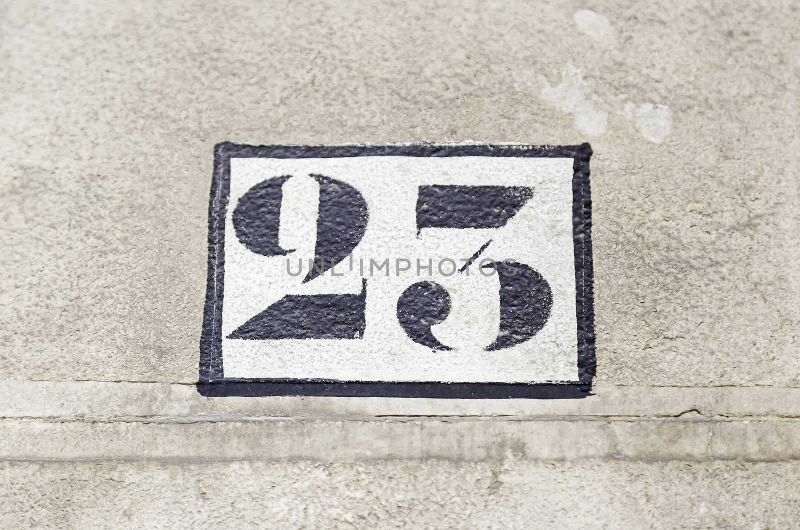 Number twenty on a wall, detail of figures on the wall of a house number information