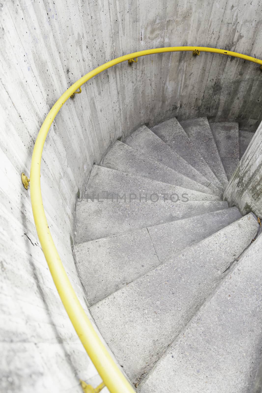 Spiral staircase in the city, detail of modern architecture, urban life