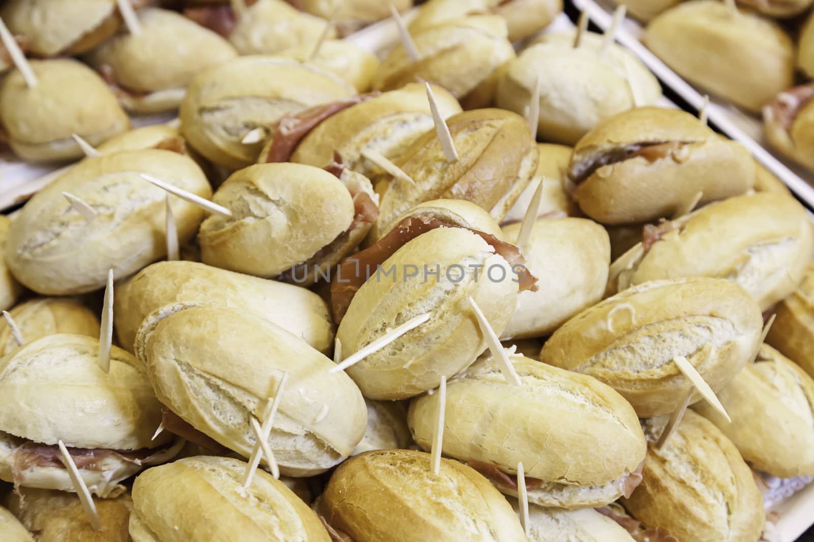 Bread sandwiches with ham, detail of an appetizer in a restaurant, food healthy lifestyle