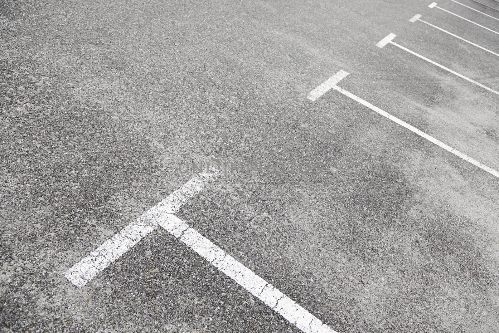 Lines on the asphalt of a parking, detail of a lines