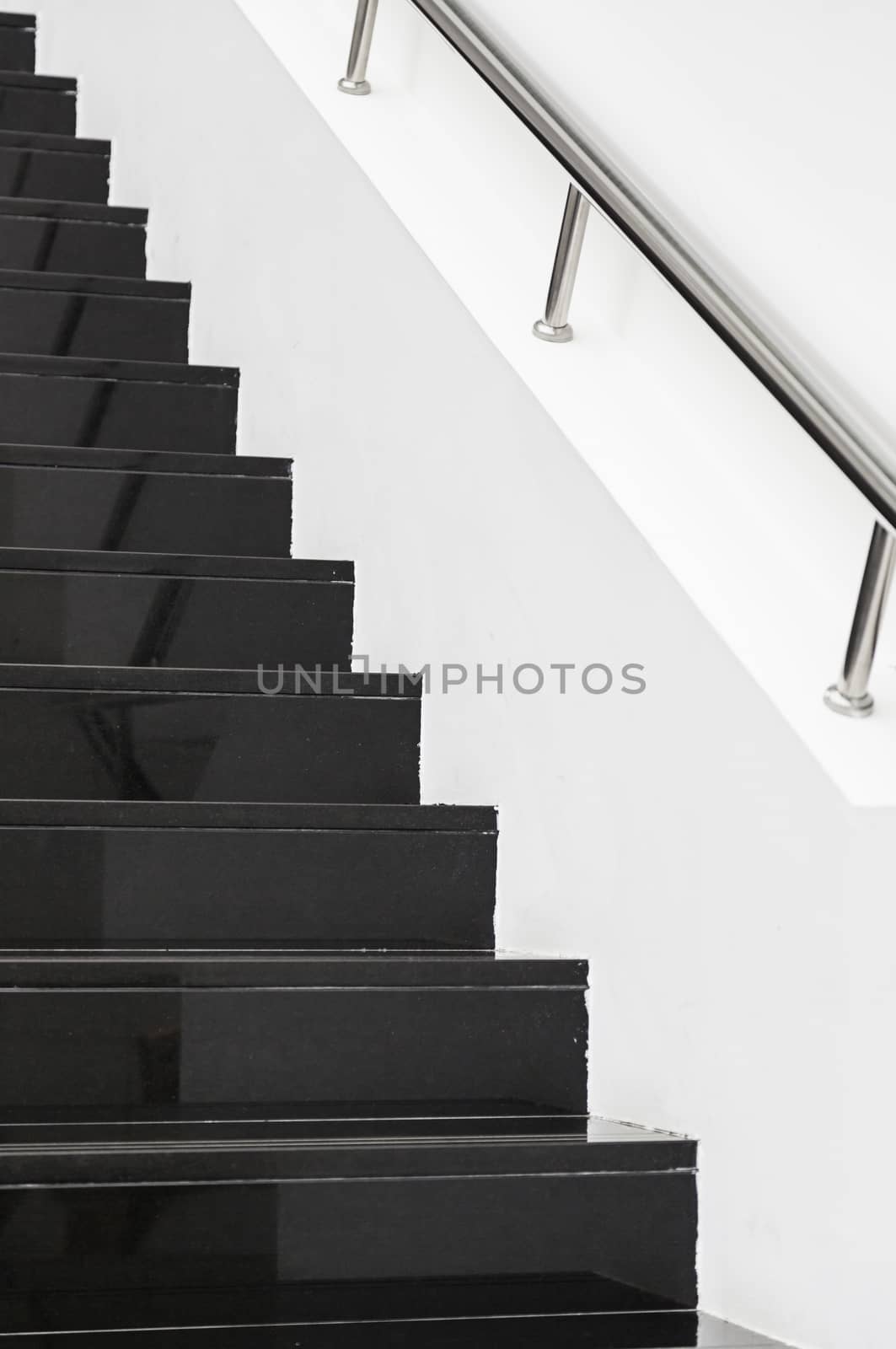 Black marble stairs, detail of the interior of a modernist building, modern architecture
