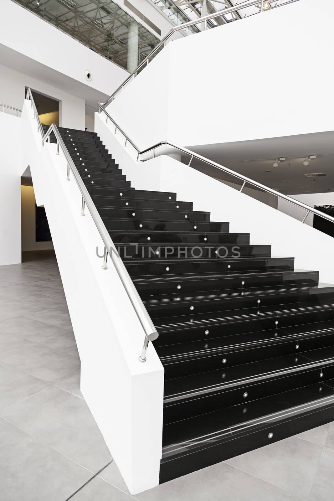 Black marble stairs, detail of the interior of a modernist building, modern architecture