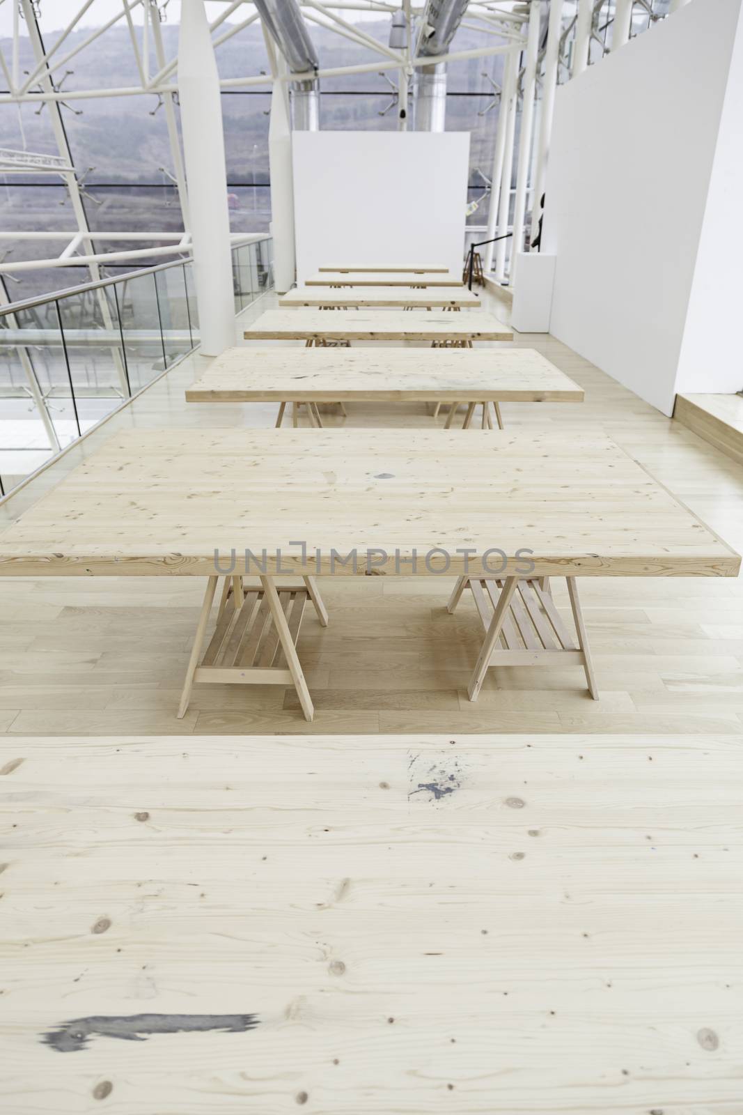 Simple wooden tables, a detail of unpainted wooden tables, support and indoor decoration, furniture