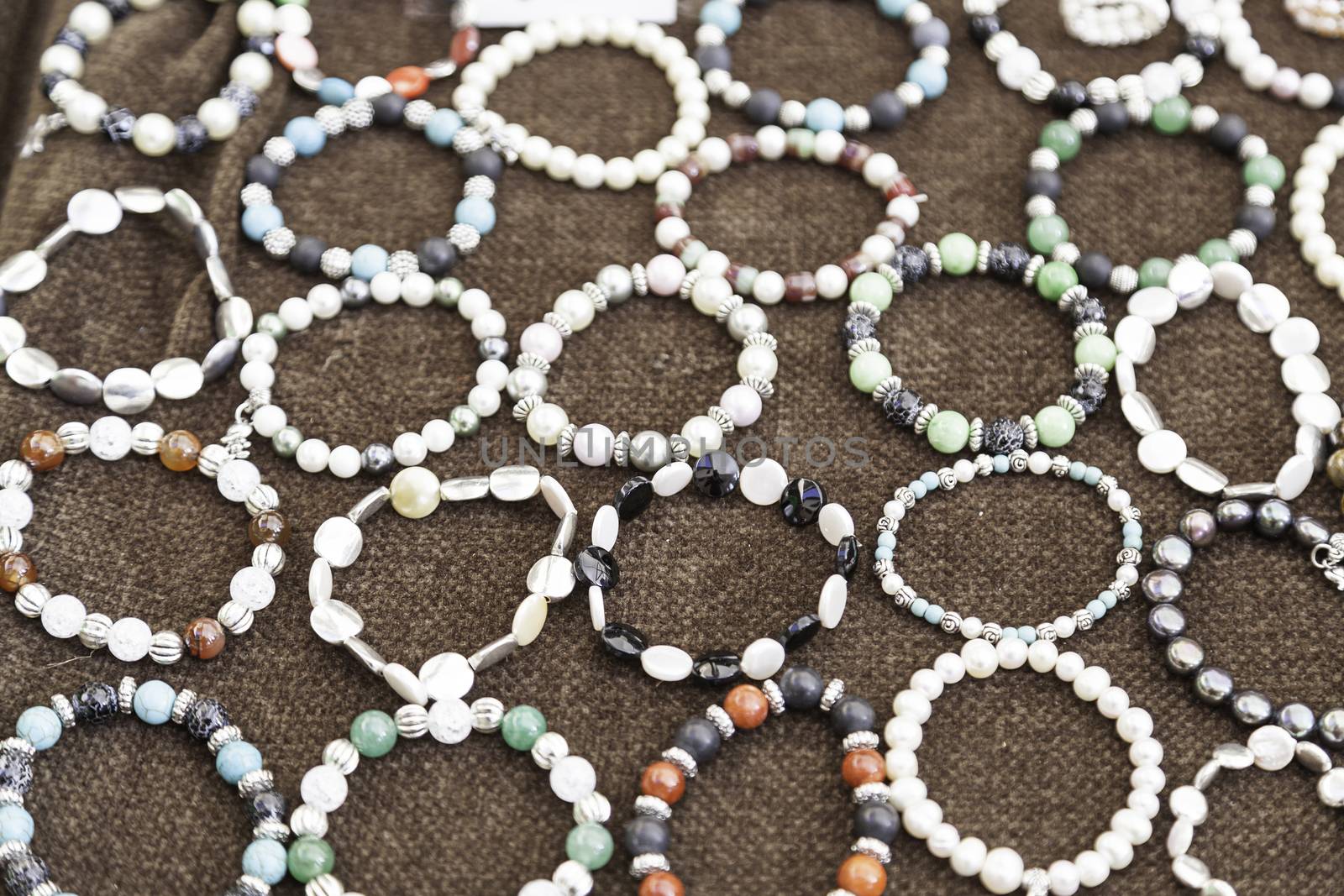 Bracelets handmade in a market, detail of a complement to the woman wrist, fashion