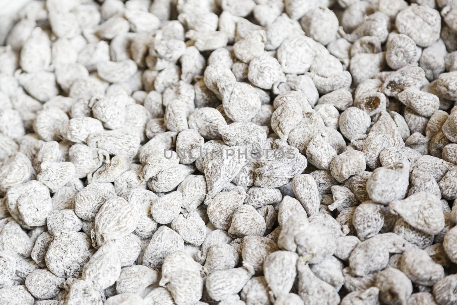 White dried figs in a market, detail of a dry fruit preserved in a traditional store, sweet food