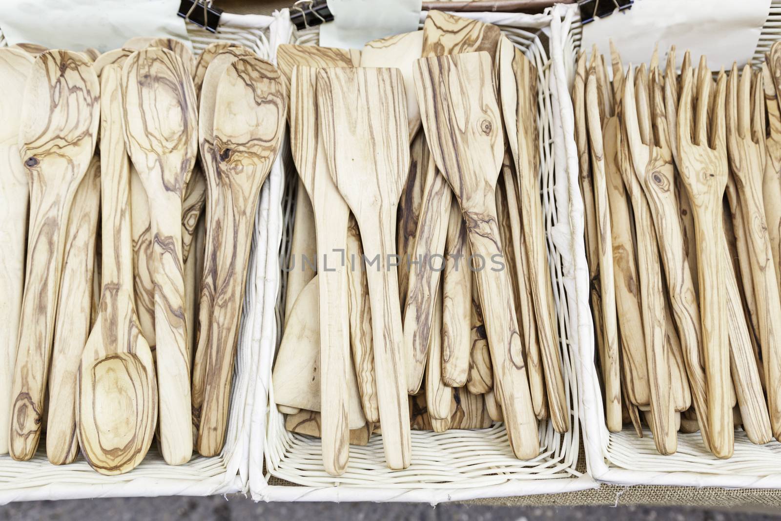 Forks and spoons, detail of wooden kitchen utensils, handmade product