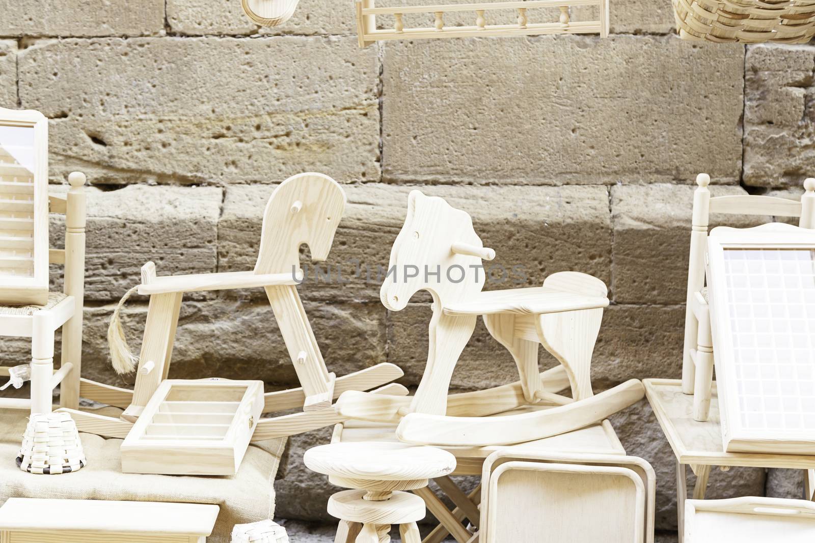 Detail of a wooden horses, woodwork, classic playground