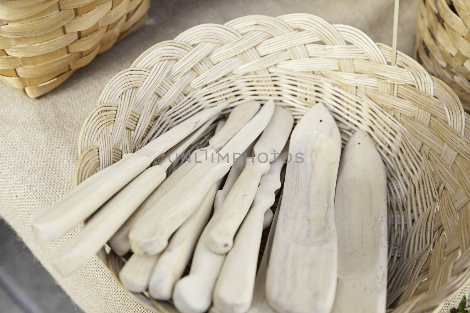 Forks and spoons, detail of wooden kitchen utensils, handmade product
