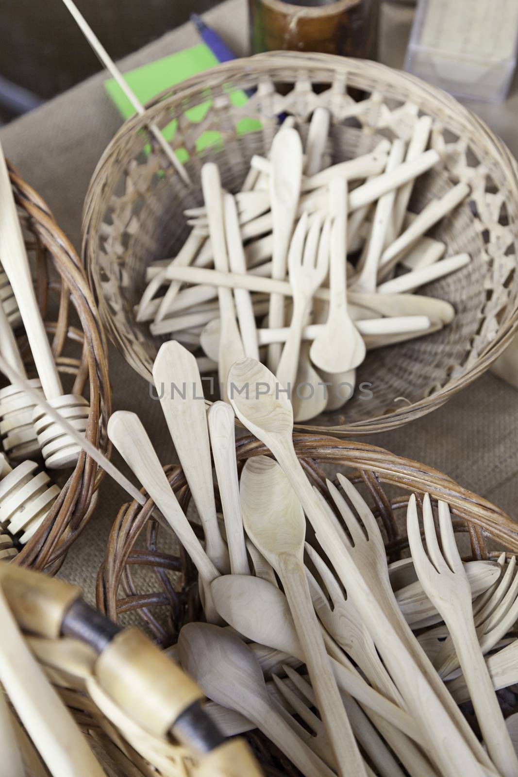 Forks and spoons, detail of wooden kitchen utensils, handmade product