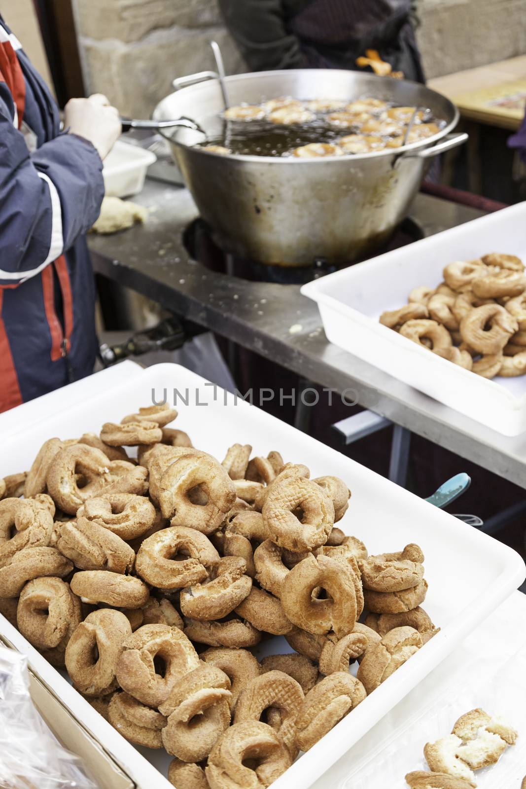 Frying donuts in the street, detail of a market, dessert, food for healthy life