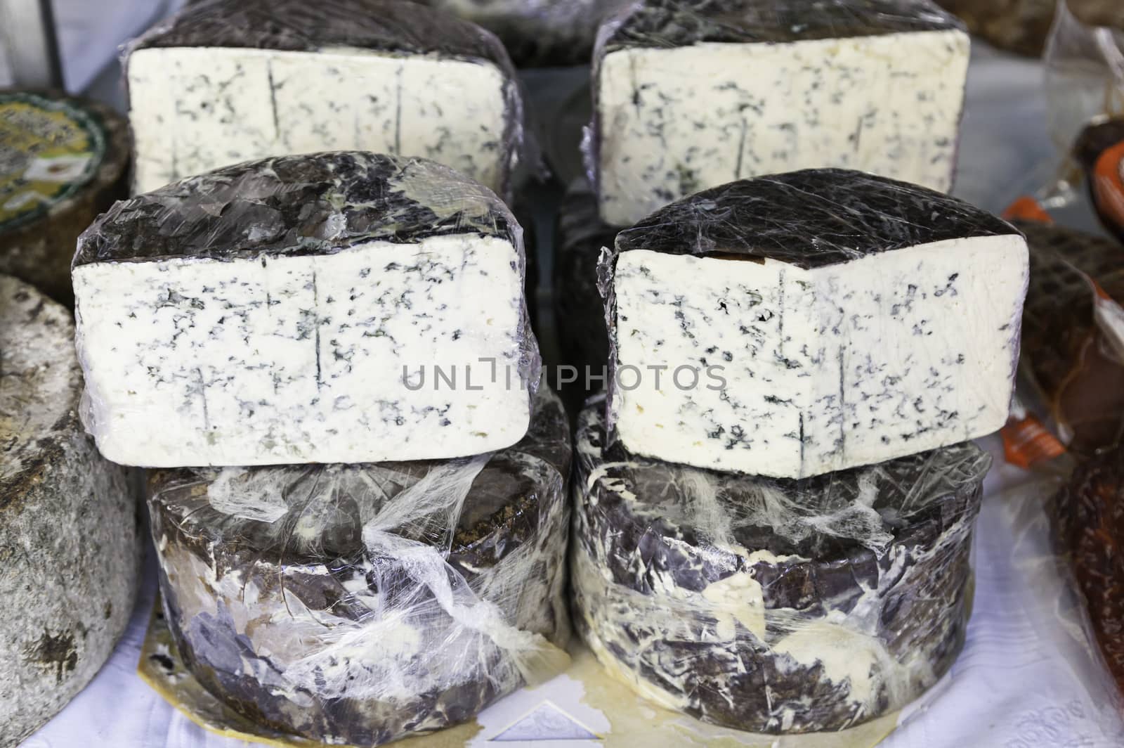 Blue Cheese in a market, detail of an old cheese on a post at a store, healthy food